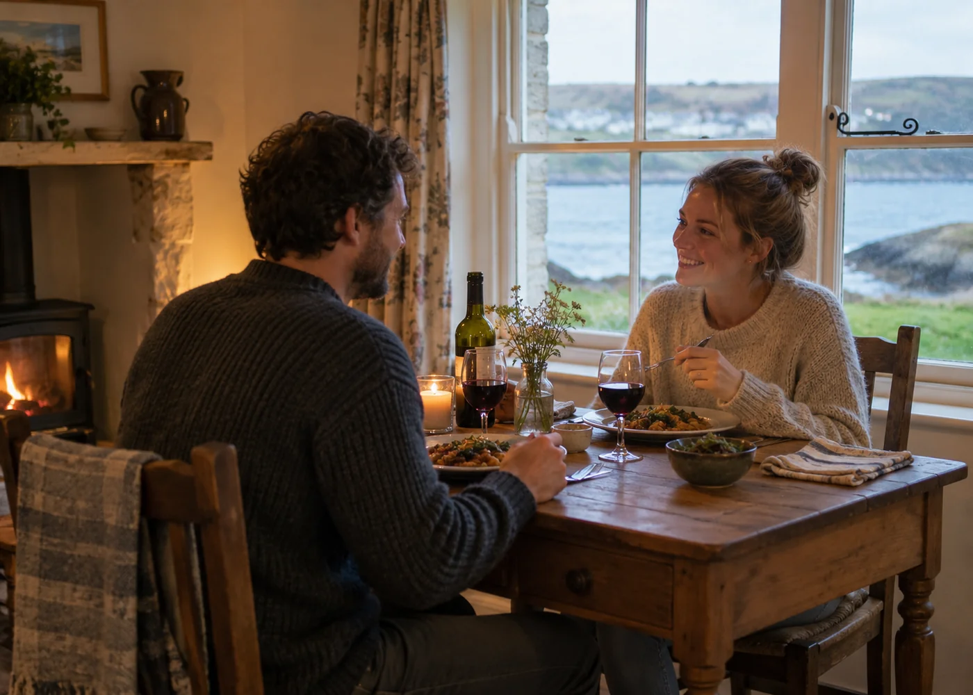Dinner for two beside a cottage window.